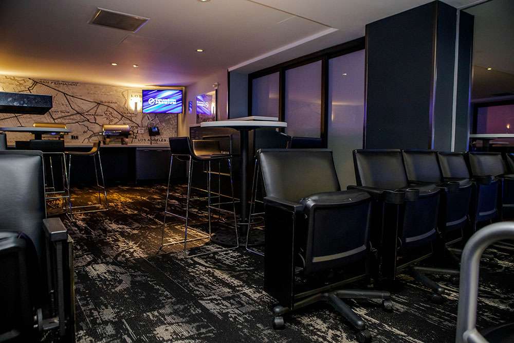 Wide, padded stadium seats at a Level C Suite at Crypto.com Arena, Los Angeles.