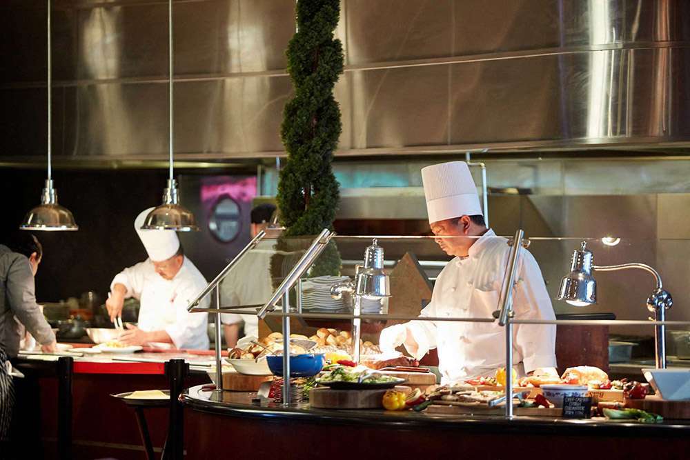 Chefs preparing premium refreshments at the Premier Lounge at Yaamava Club by San Manuel at Crypto.com Arena, Los Angeles.