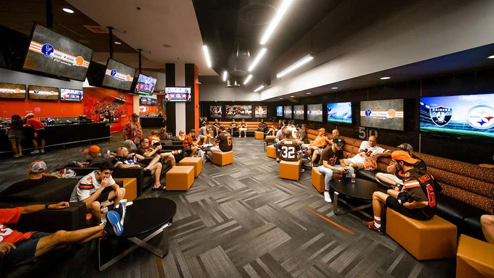 Lounge seating and HD screens in The Moen Lake Club at Huntington Bank Field, Cleveland.