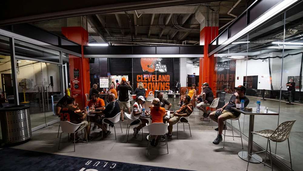 Fans relaxing in the TCP Club at Huntington Bank Field, Cleveland.